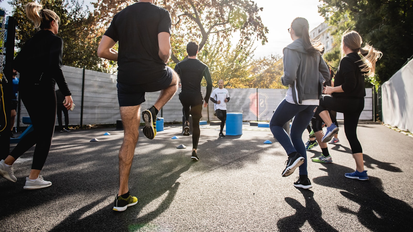 A person cooling down with a slow walk and a water bottle after a workout